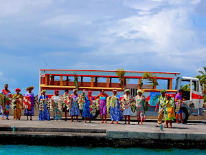  Hikueru's welcoming committee greets the Aranui passengers, standing in front of Le Truck to drive the visitors around the atoll 